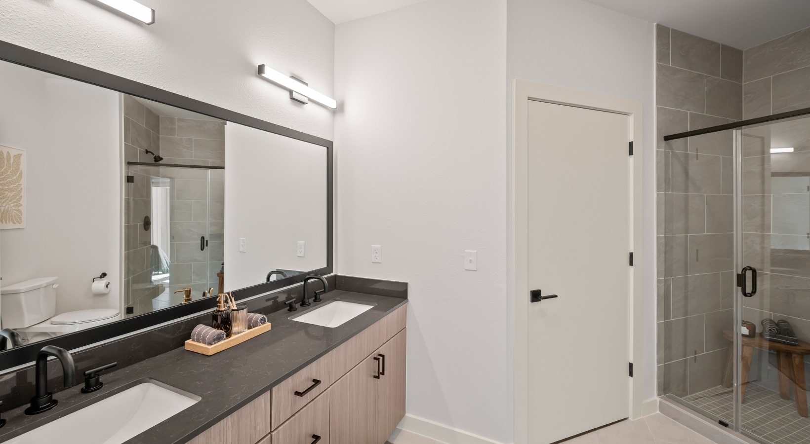 spacious bathroom with walk in shower  large bathroom with double vanity sink and walk in shower