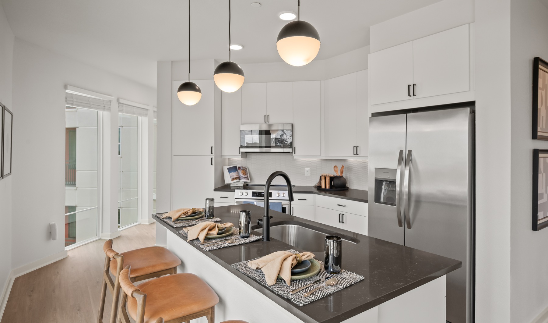 beautiful kitchens with designer finishes a kitchen with a kitchen island and sink on the island