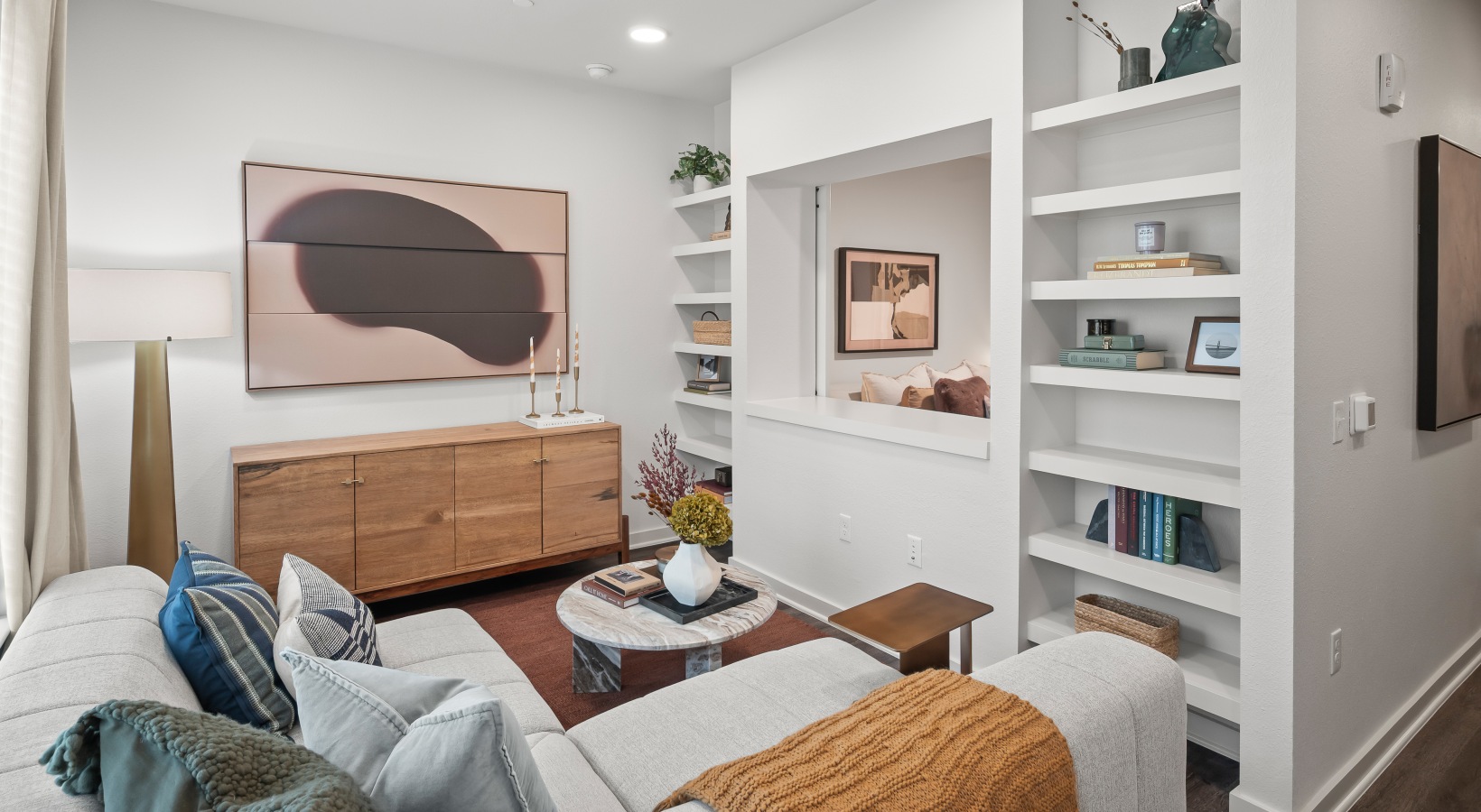 1 bedroom living room A2.1  floor plan living room with wood flooring and built in shelving