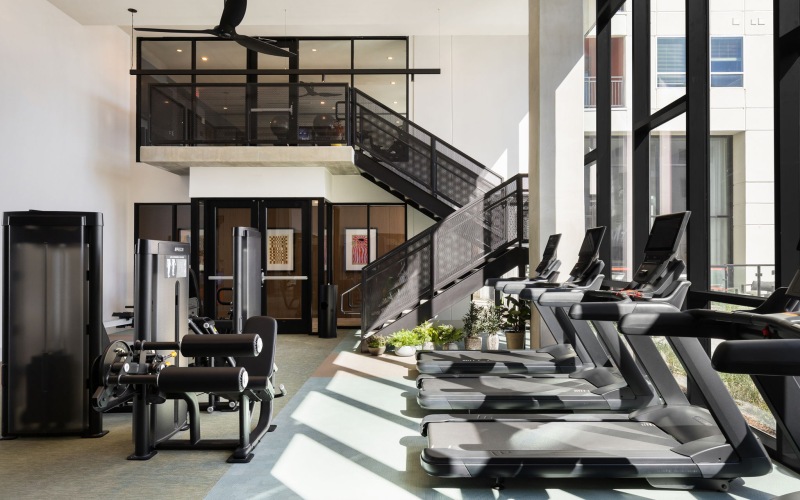 Two story fitness center with large windows