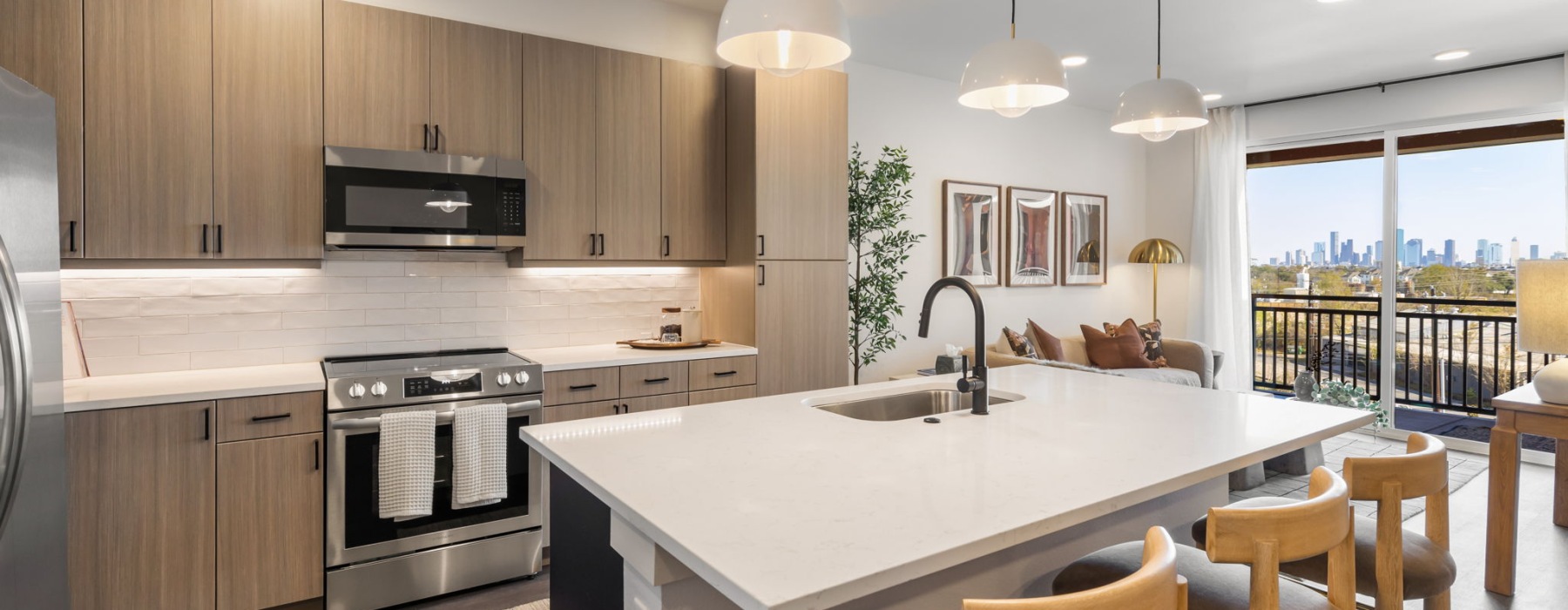 open concept kitchen and living room with city skyline views