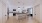 a kitchen with a wood floor and white walls