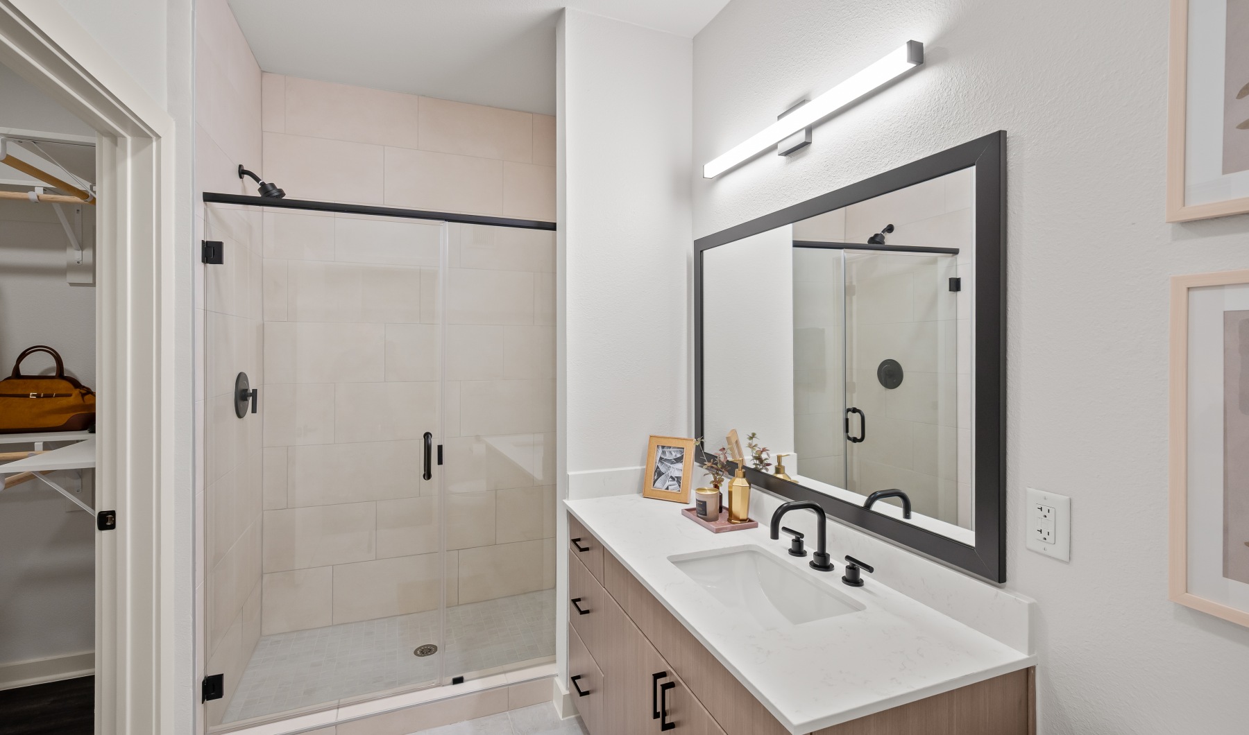 spacious bathrooms with everything you need a bathroom with a large mirror and walk in shower