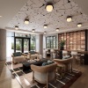 a clubhouse room with a table, chairs, and wood floors