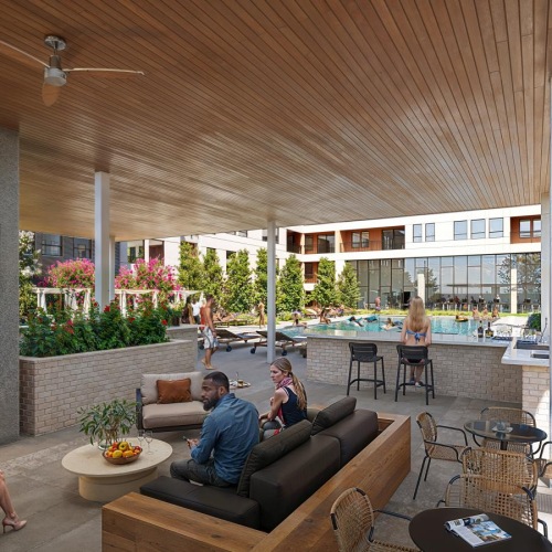 Relax and unwind poolside a man and woman sitting on a couch in a room with a fireplace